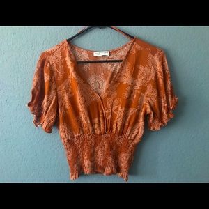 Papercrane shirt. Orange brownish color. Size Smalll